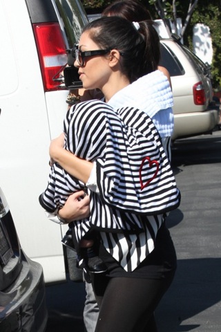 Kourtney Kardasian leaves Fred Segal boutique carrying her new baby boy Mason on Feb. 25 in L.A.
